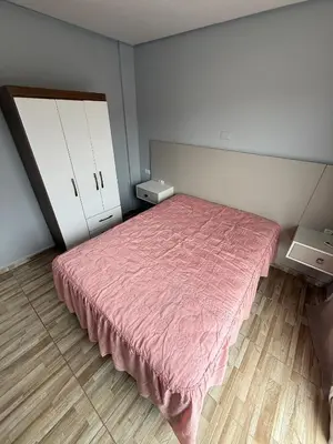 Uma cama ou camas num quarto em Hospedagem da Marli