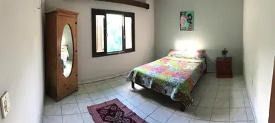 Uma cama ou camas num quarto em Casinha da praia