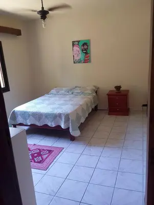 Uma cama ou camas num quarto em Casinha da praia