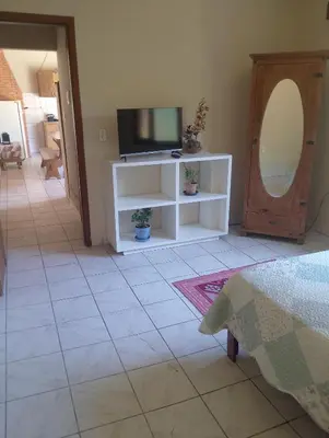 Uma televisão e/ou sistema de entretenimento em Casinha da praia