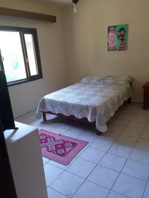 Uma cama ou camas num quarto em Casinha da praia