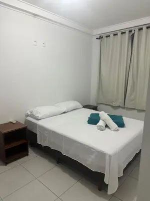 Uma cama ou camas num quarto em Apto 2 quartos Recanto do cardeal em Bombas