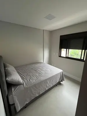 Uma cama ou camas num quarto em Apartamento Pé na Areia