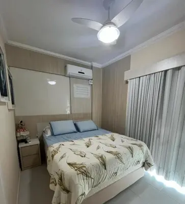 Uma cama ou camas num quarto em Apartamento 150 metros da praia