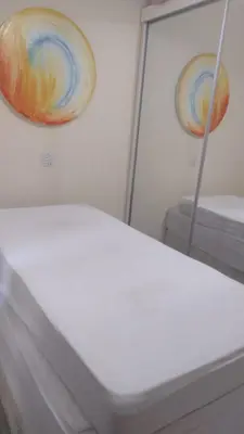 Uma cama ou camas num quarto em Apartamento 150 metros da praia