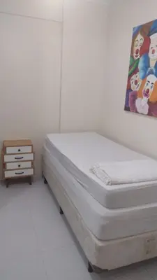 Uma cama ou camas num quarto em Apartamento 150 metros da praia