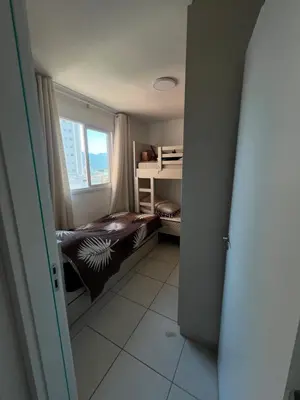 Uma cama ou camas num quarto em Vista Atlântico