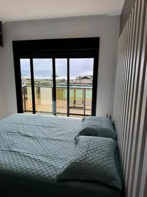 Uma cama ou camas num quarto em Suite exclusive vista mar