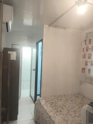 Uma cama ou camas num quarto em Apart no centro de Porto Belo