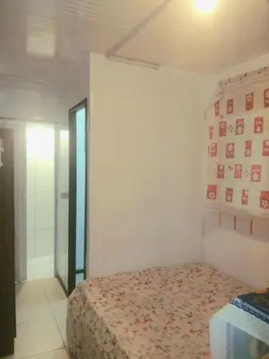 Uma cama ou camas num quarto em Apart no centro de Porto Belo