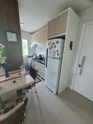 A cozinha ou kitchenette de Lindo apartamento na Praia de Palmas