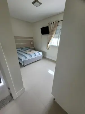 Uma cama ou camas num quarto em Lindo apartamento na Praia de Palmas