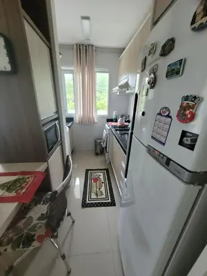 A cozinha ou kitchenette de Lindo apartamento na Praia de Palmas