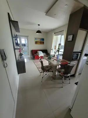 Uma televisão e/ou sistema de entretenimento em Lindo apartamento na Praia de Palmas