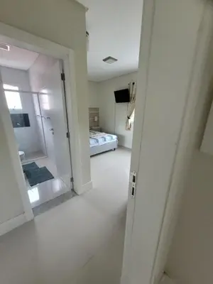 Uma cama ou camas num quarto em Lindo apartamento na Praia de Palmas