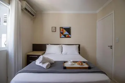 Uma cama ou camas num quarto em QUA21 - 3Dorm, Churrasqueira na sacada, Garagem