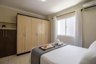 Uma cama ou camas num quarto em QUA21 - 3Dorm, Churrasqueira na sacada, Garagem