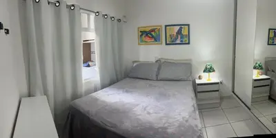 Uma cama ou camas num quarto em Apartamento Itapema centro