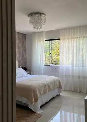 Uma cama ou camas num quarto em Casa Camboriú