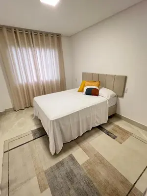Uma cama ou camas num quarto em Casa Camboriú