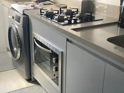 A cozinha ou kitchenette de Apart Luxo Palmas Beach 200m com garagem