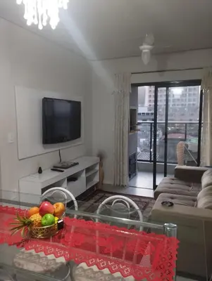 Uma televisão e/ou sistema de entretenimento em Apartamento Itapema 3 quartos
