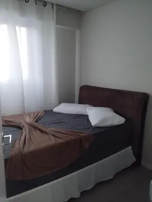 Uma cama ou camas num quarto em Apartamento Itapema 3 quartos