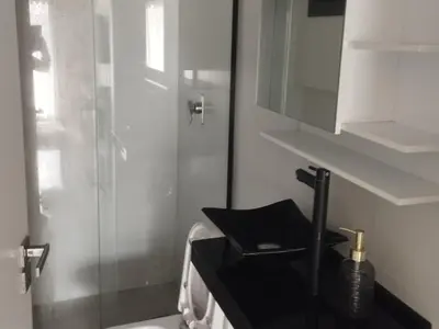 Uma casa de banho em Apartamento Itapema 3 quartos