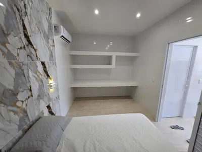 Uma cama ou camas num quarto em RB House