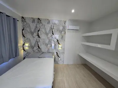 Uma cama ou camas num quarto em RB House