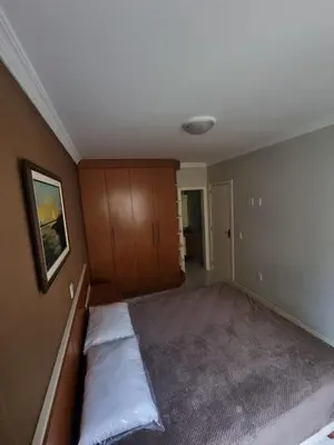 Uma cama ou camas num quarto em Apartamento Itapema Meia Praia