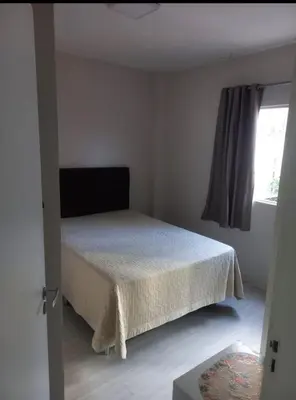 Uma cama ou camas num quarto em Apartamento quadra mar meia praia