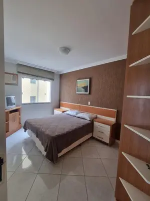 Uma cama ou camas num quarto em Apartamento Itapema Meia Praia
