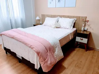 Uma cama ou camas num quarto em Apartamento 2 quartos 6 minutos à pé da praia