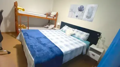 Uma cama ou camas num quarto em Apartamento 2 quartos 6 minutos à pé da praia