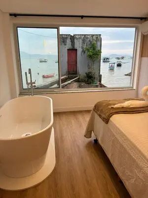Uma cama ou camas num quarto em Morada Som do Mar