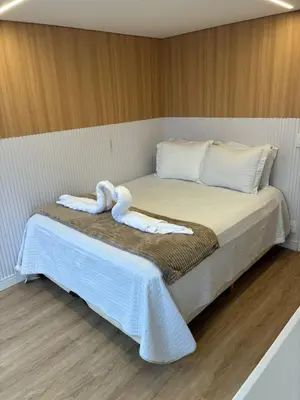 Uma cama ou camas num quarto em Morada Som do Mar