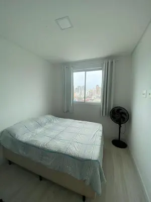 Uma cama ou camas num quarto em Itapema apartment