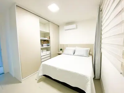 Uma cama ou camas num quarto em Apê Novo em Porto Belo com Piscina próx Bombinhas