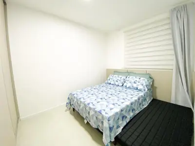 Uma cama ou camas num quarto em Apê Novo em Porto Belo com Piscina próx Bombinhas