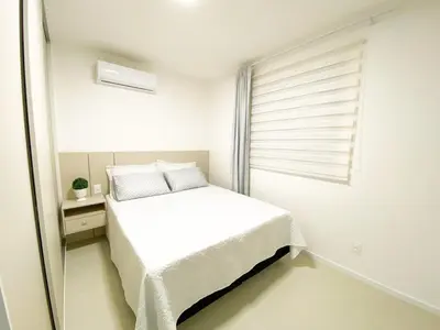 Uma cama ou camas num quarto em Apê Novo em Porto Belo com Piscina próx Bombinhas