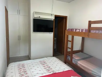 Uma cama ou camas num quarto em Casa de Praia, a 250 metros do mar, com piscina exclusiva