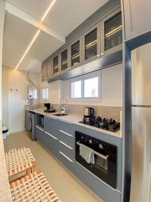 A cozinha ou kitchenette de Conforto e modernidade na praia 400m - mar