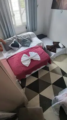Uma cama ou camas num quarto em Quarto Prime até 4 pessoas familia, piscina, Pousada Lua Encantada Pousada Tijucas