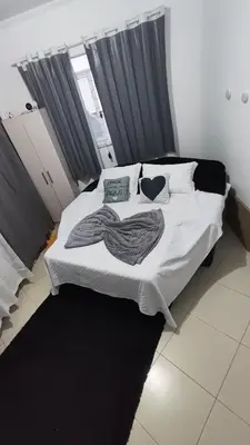 Uma cama ou camas num quarto em Quarto Prime até 4 pessoas familia, piscina, Pousada Lua Encantada Pousada Tijucas