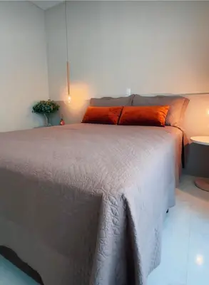 Uma cama ou camas num quarto em Apartamento frente mar aconchegante e impecável - Alto Padrão