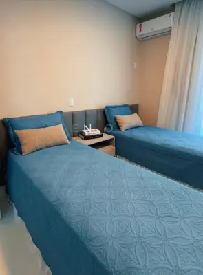 Uma cama ou camas num quarto em Apartamento frente mar aconchegante e impecável - Alto Padrão