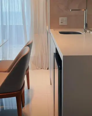 A cozinha ou kitchenette de Apartamento frente mar aconchegante e impecável - Alto Padrão