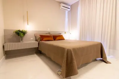 Uma cama ou camas num quarto em Apartamento frente mar aconchegante e impecável - Alto Padrão