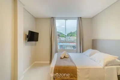 Uma cama ou camas num quarto em Estúdios na Barra em Balneário Camboriú - DPR